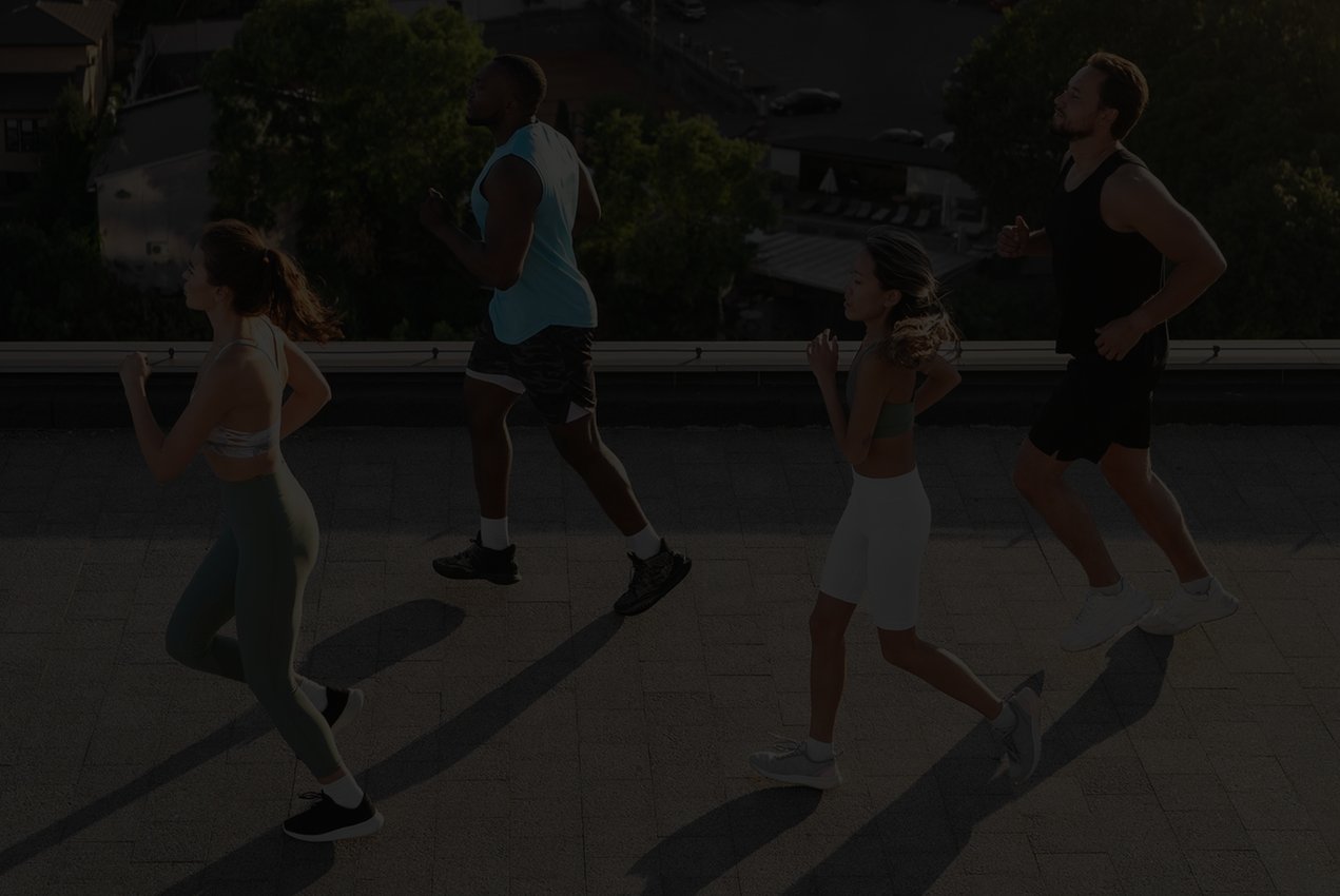 Athletes running together. Possibly a run club? They all look happy and healthy!