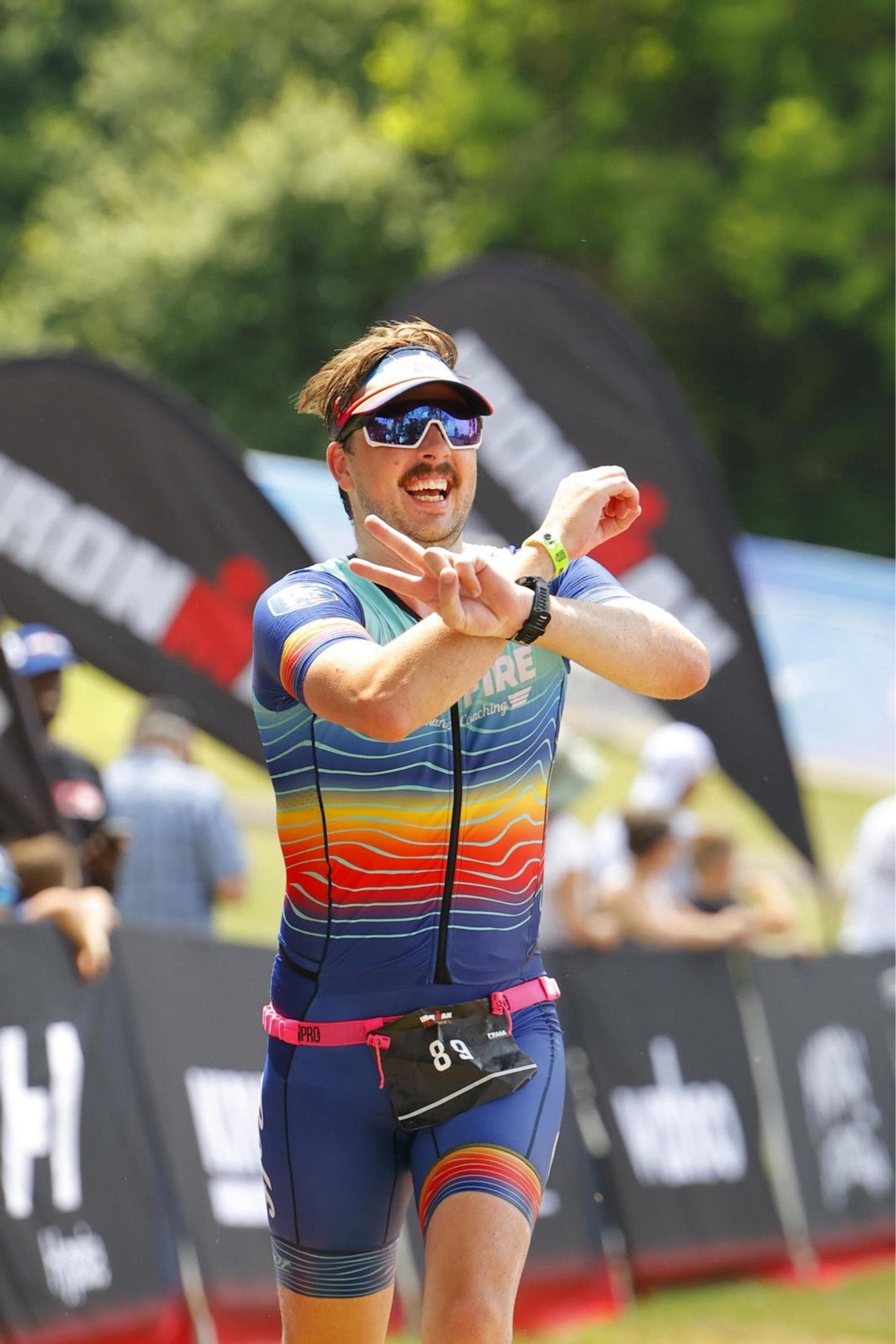 Happy athlete, smiling, and celebrating their 20th race.